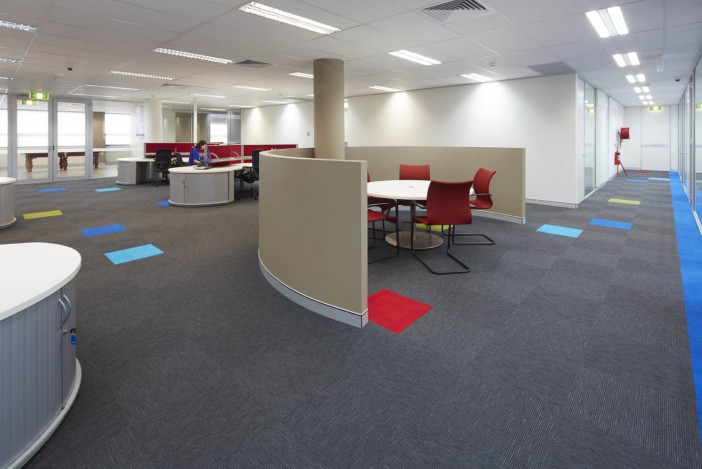 Curved workstations in open plan office